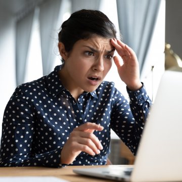 Shocked looking person at a laptop